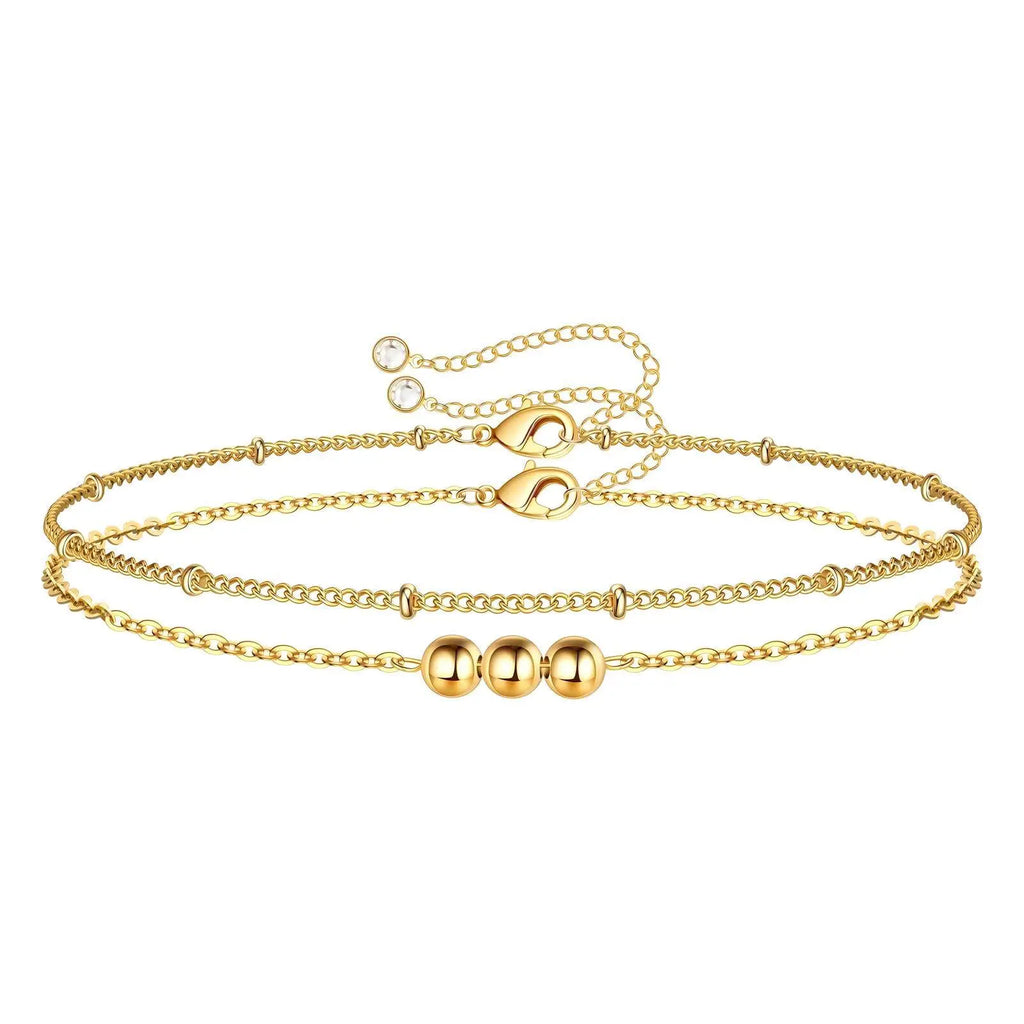 Gold bracelet with multiple chains on a white background