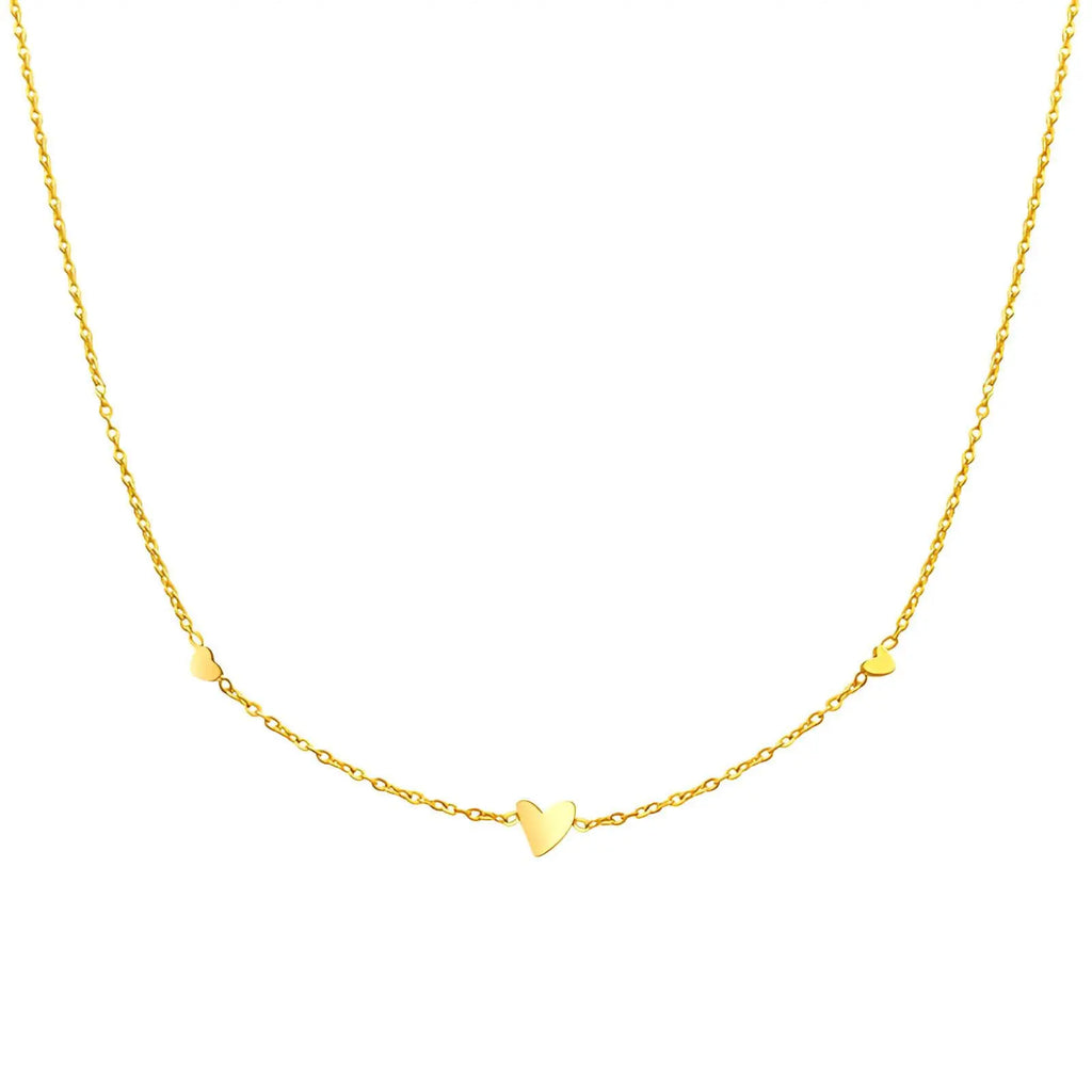 very dainty Gold necklace with heart-shaped pendants on a white background