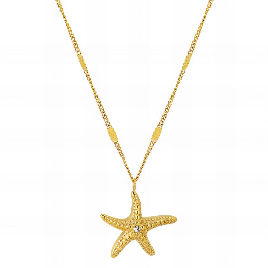 Gold starfish pendant necklace on a white background