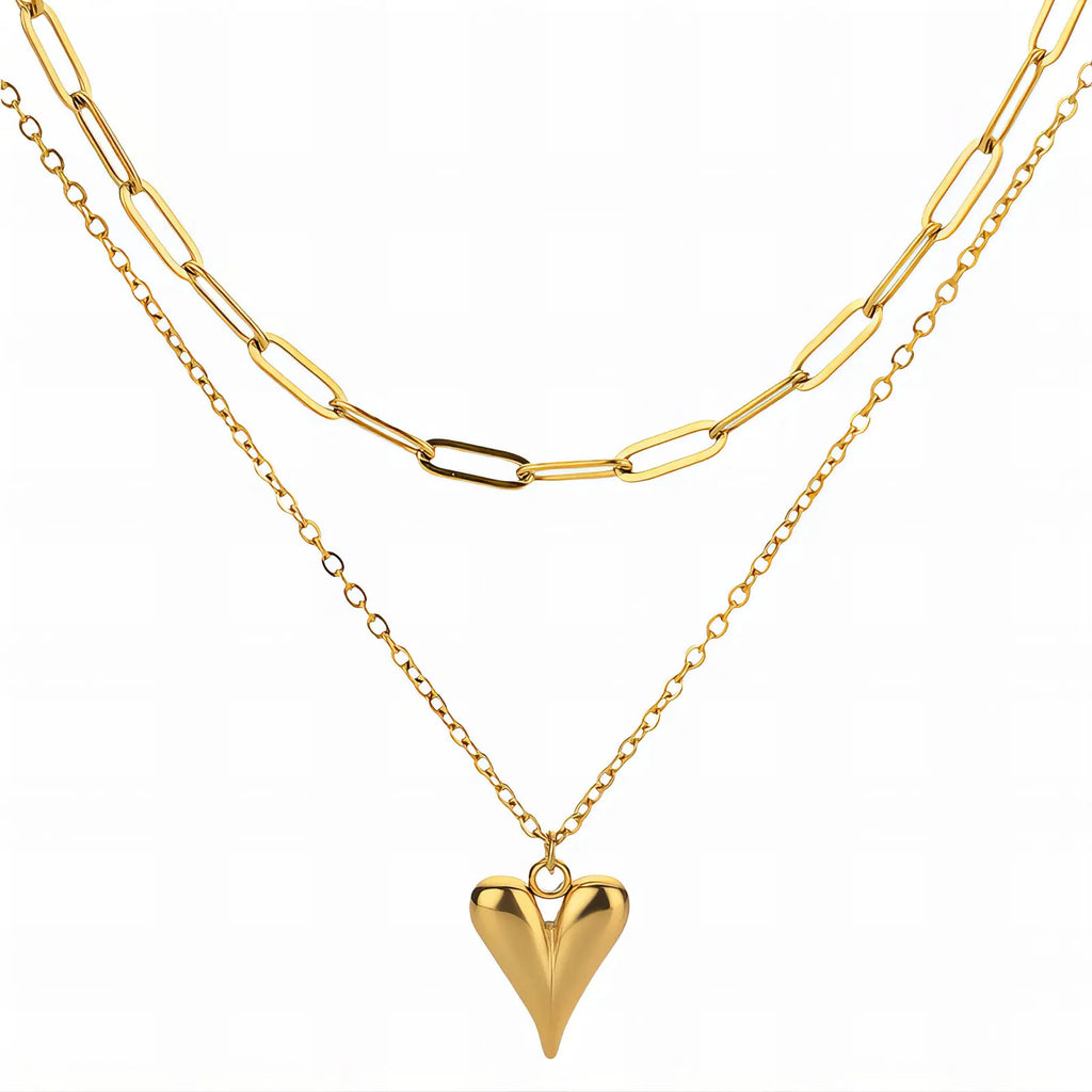 Two gold necklaces with a heart pendant on a white background