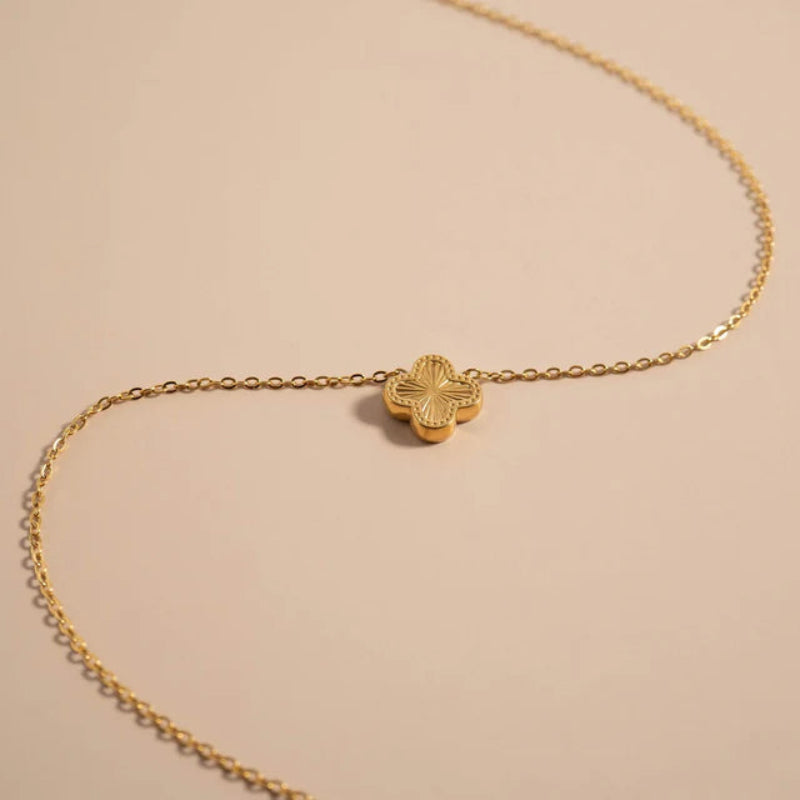 18K gold PVD coated waterproof, non-tarnish, hypoallergenic gold clover necklace.