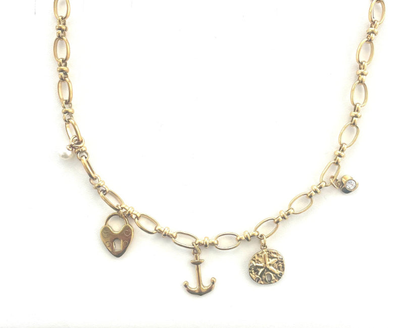 18K gold PVD coated waterproof, non-tarnish, hypoallergenic charm necklace featuring a pearl, diamond heart, sand dollar, anchor, and heart locket charms.