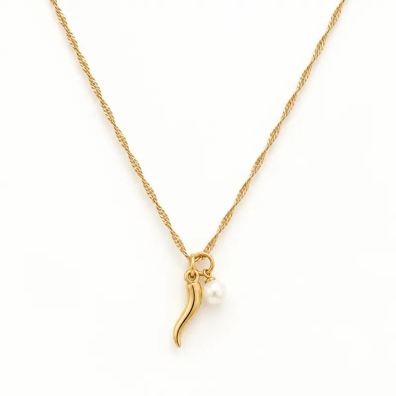 Gold Italian horn and white pearl charm necklace with a delicate Singapore chain displayed on a white background.