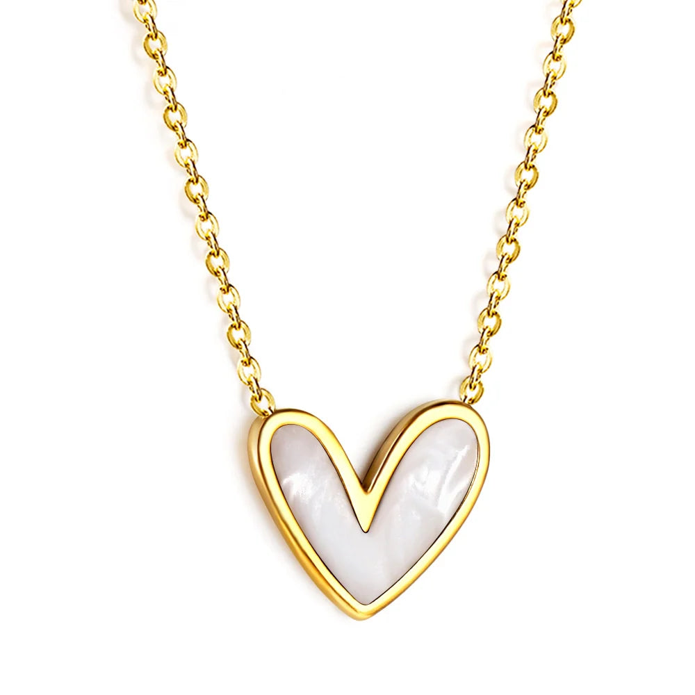 A gold heart pendant necklace with a white mother-of-pearl inlay, shown on a clean white background.