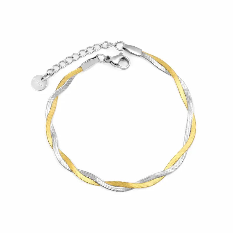 mixed metal gold and silver bracelet on white background