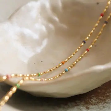 close up of rainbow gold chain necklace
