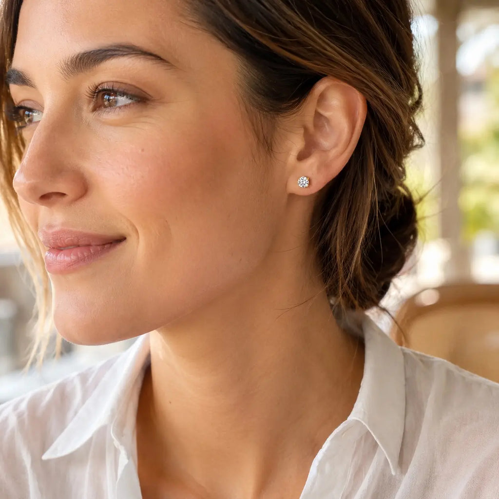 close up of a woman wearing Diamond Stud Earrings
